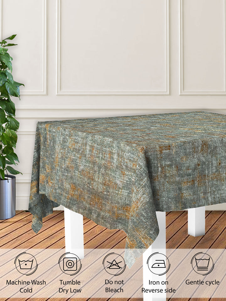 Textured tablecloth on a wooden table with care instructions displayed below.