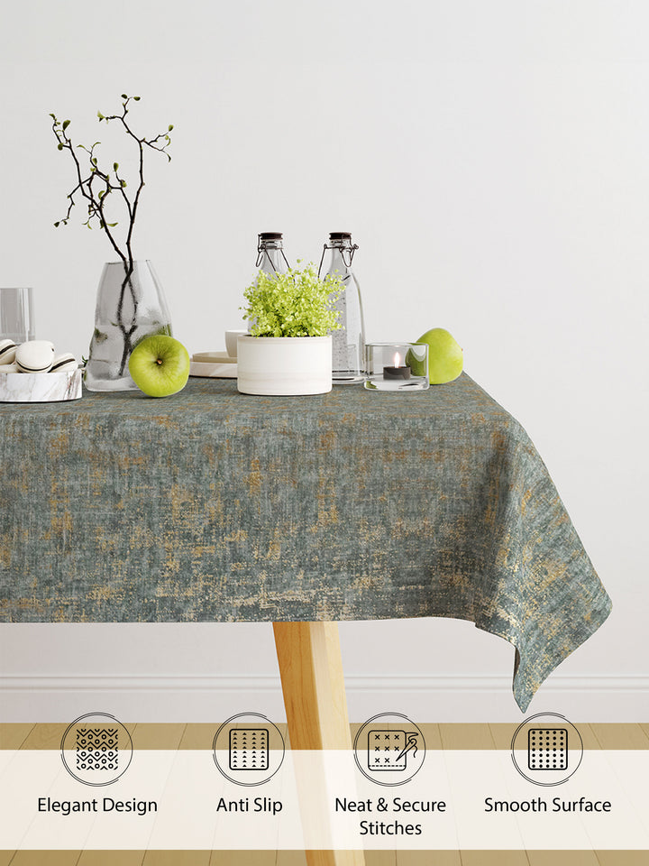 Tablecloth with decorative elements on a table against a white wall