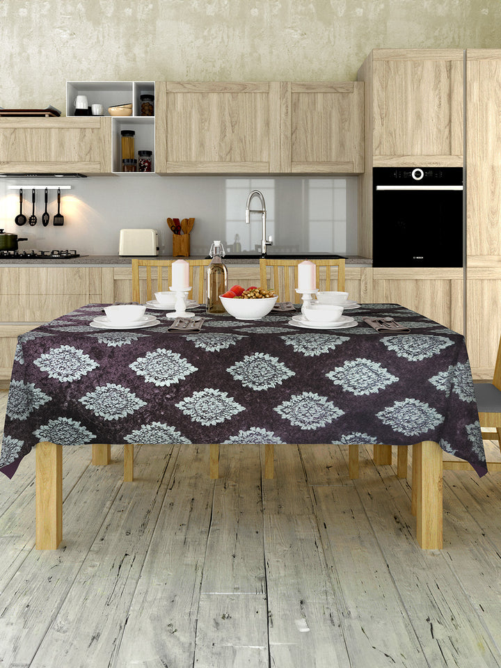 Kitchen with wooden table and patterned tablecloth