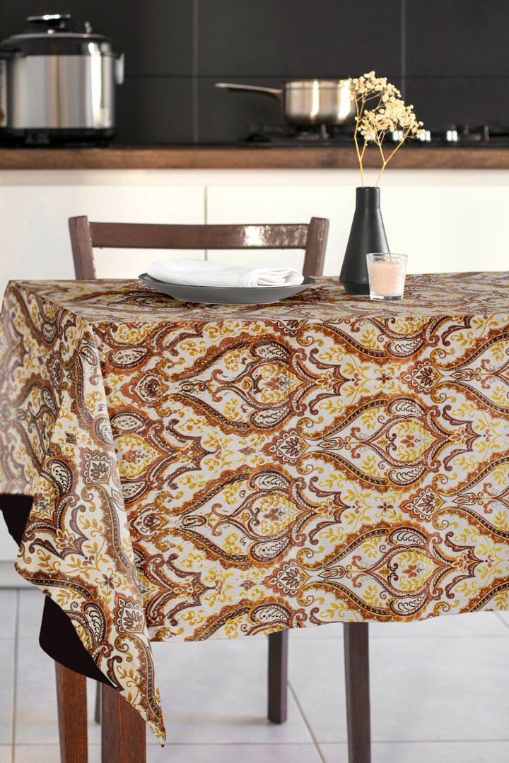 Patterned tablecloth on a dining table in a kitchen setting