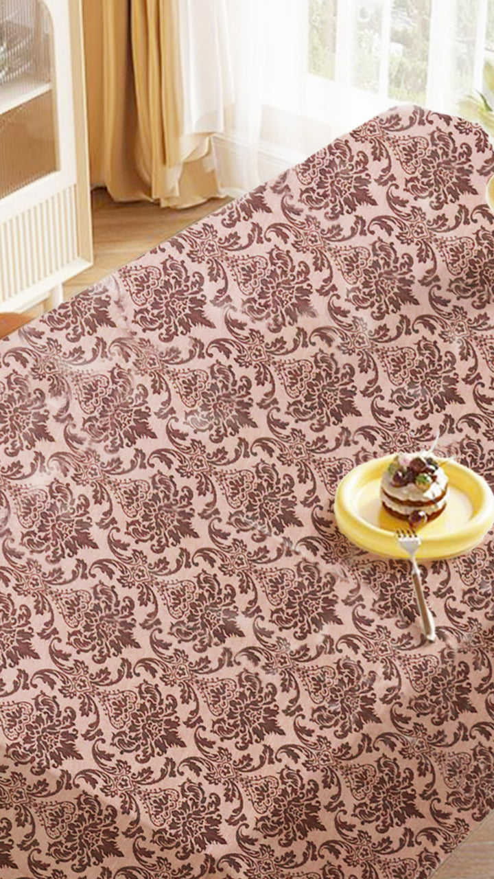 Patterned tablecloth with a cake on a yellow plate in the foreground