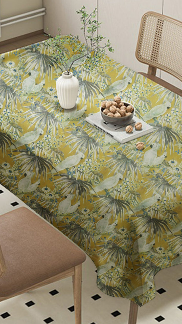 Tablecloth with floral and bird pattern on a dining table